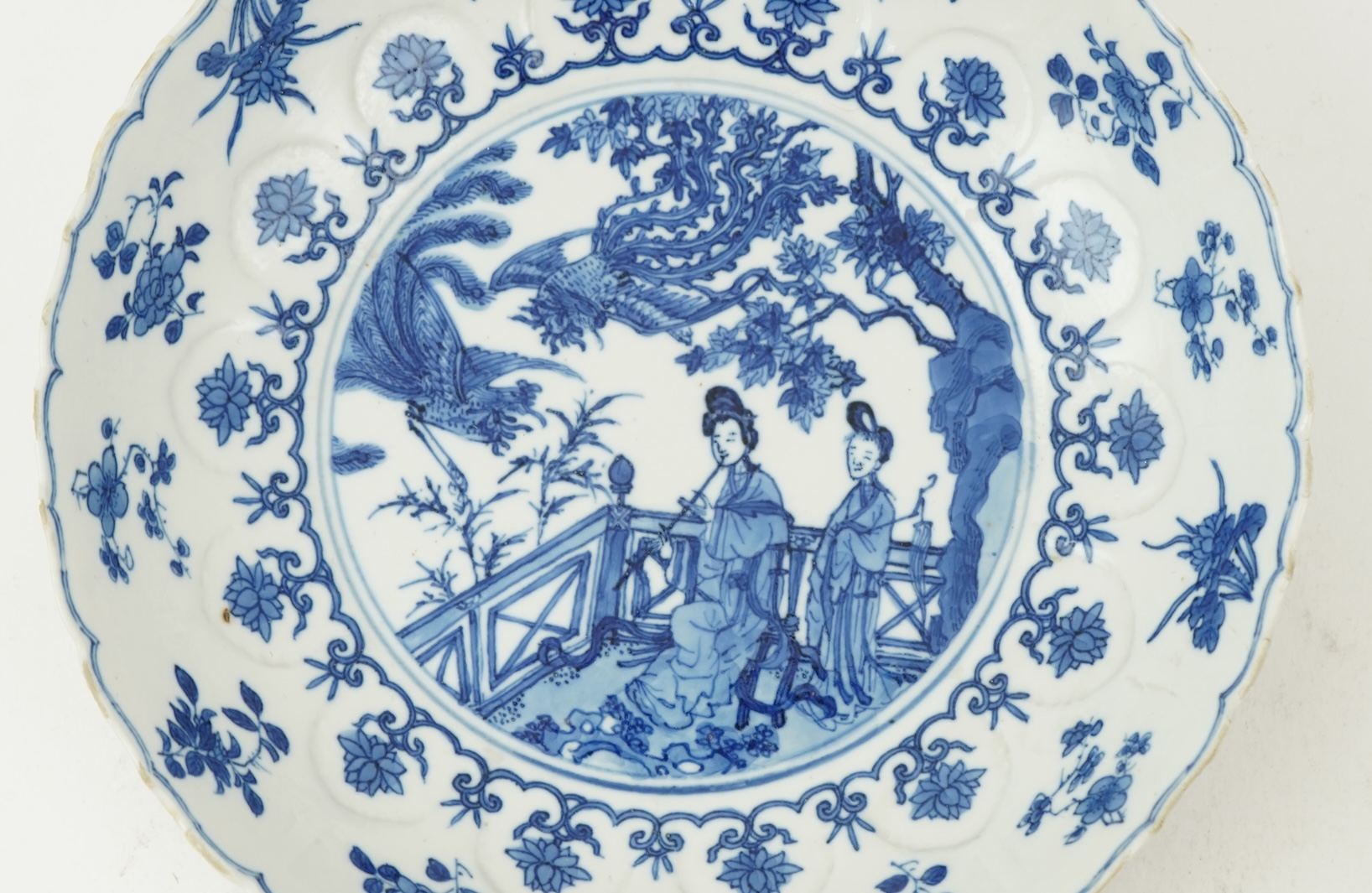 A Chinese blue and white ‘ladies and phoenix’ dish, Kangxi period